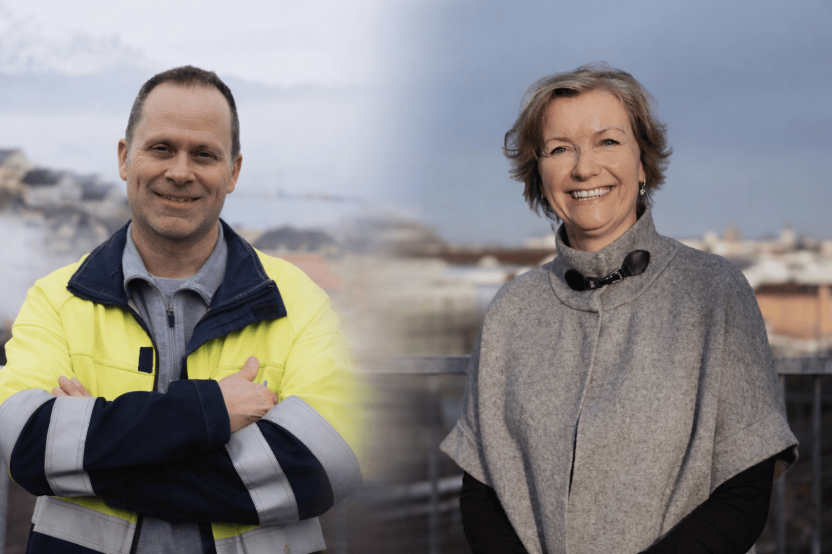 Ein Mann in einer gelben Sicherheitsjacke steht mit verschränkten Armen im Freien und lächelt. Neben ihm lächelt eine Frau mit einem grauen Schal, ebenfalls im Freien. Der Hintergrund ist unscharf und zeigt eine Stadtlandschaft unter einem bewölkten Himmel.