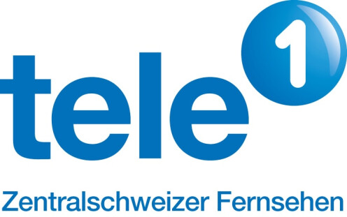 Blau-weisses Logo mit dem Schriftzug „tele“ in blauer, runden Schriftart, gefolgt von einer weissen „1“ in einer blauen Kugel. Darunter steht in kleinerer Schrift „Zentralschweizer Fernsehen“.